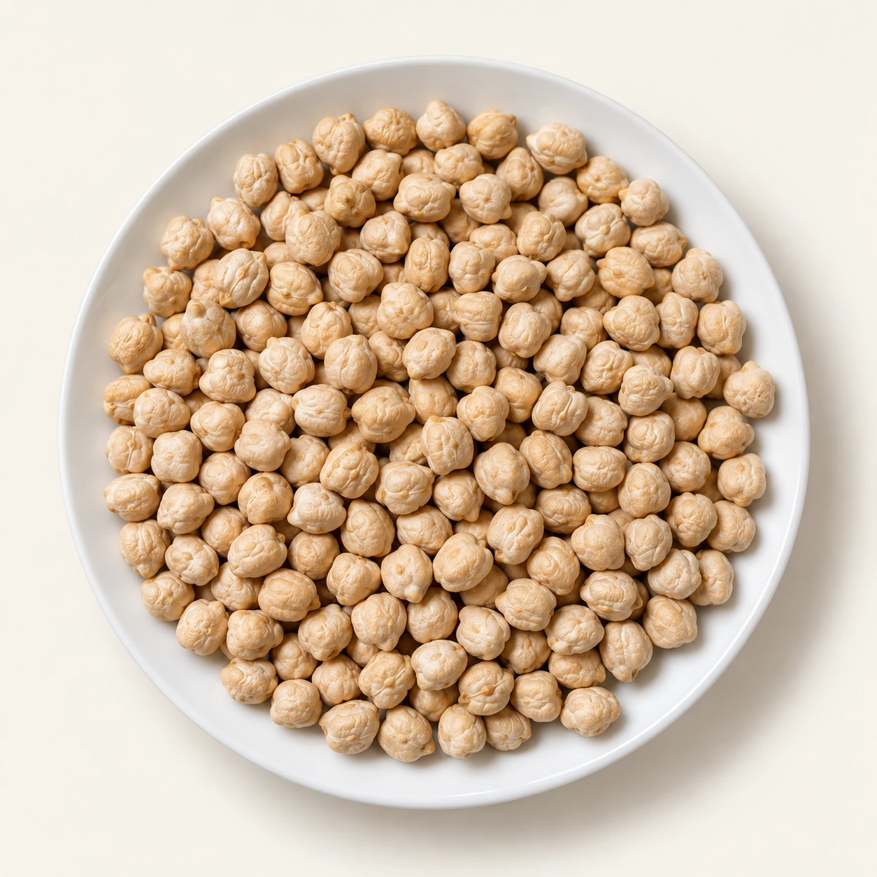 Representative close-up of chickpeas on a white plate